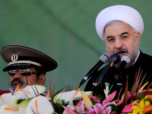 Iran's President Hassan Rouhani gives a speech during an annual military parade in Tehran on Sept, 22, 2013.