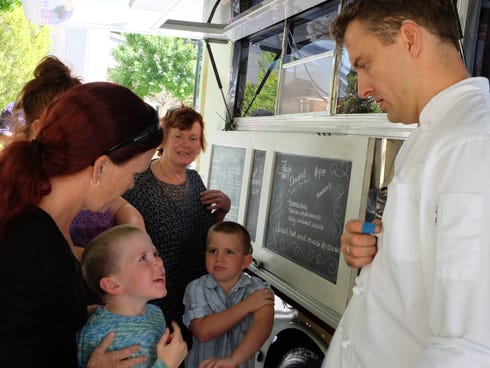 Guests line up at for bombolini at the FS Taste Truck at the Four Seasons Hotel Silicon Valley at East Palo Alto, the first stop on an 8-week tour of Four Seasons' properties in California, Arizona and New Mexico. Each location offers different fare.