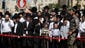 Ultra-Orthodox Jews stand near the scene of an attack in Jerusalem where a Palestinian man rammed a construction excavator into a passenger bus.