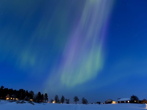 The Aurora Borealis bright up the sky at twilight on March 17, 2013, between the towns of Are and Ostersund, in Sweden.