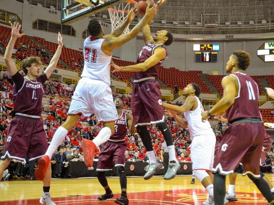 UL's Shawn Long (21) works under the basket in Saturday's