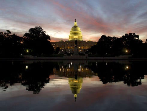 The U.S. Capitol dome is seen at sunrise over Washington, D.C., September 25, 2013.