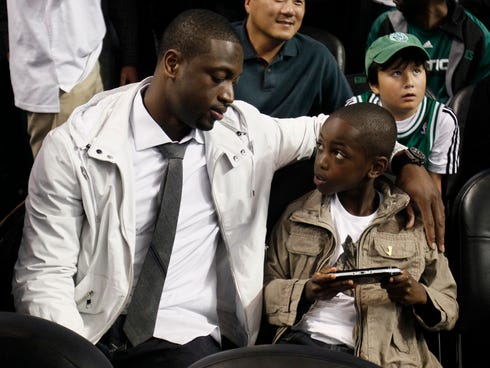 Miami Heat's Dwyane Wade, left, got some  help from son Zaire when he proposed to Gabrielle Union.