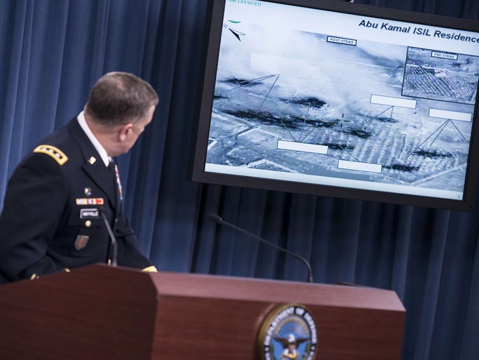 U.S. Army Joint Staff Director of Operations Lt. Gen. William Mayville Jr. shows before and after images of airstrikes in Syria during a briefing at the Pentagon on Sept. 23. U.S. and Arab nations staged joint airstrikes overnight against Islamic State targets in Syria and unilateral airstrikes against an al-Qaeda group in Syria.