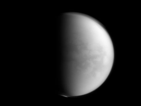 This undated image provided by NASA shows Saturn���s largest moon, Titan. NASA���s Cassini spacecraft has detected the presence of a plastic ingredient in Titan���s atmosphere, the first time the chemical has been found in a world other than Earth.