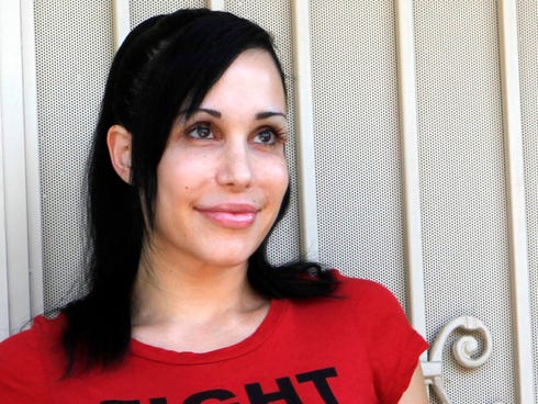 Nadya Suleman stands  outside her home in La Habra, Calif.