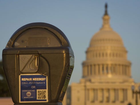 The U.S. Capitol is seen behind a parking meter in Washington, D.C