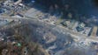 An aerial view shows destroyed buildings along U.S.