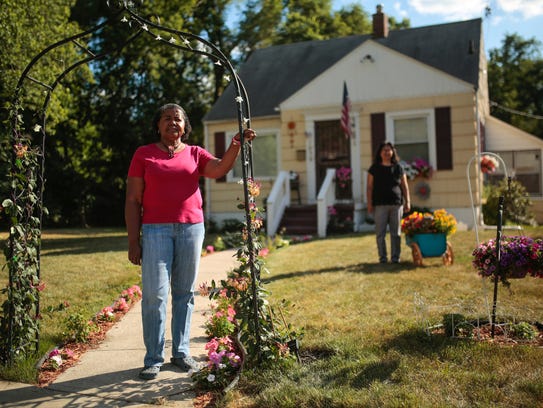 Sonia Banner, 60, of Flint stands outside of her home