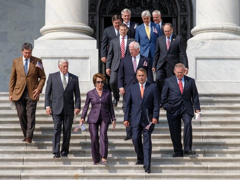 Members of Congress arrive for a ceremony to remember the 9/11 terror attacks on Sept. 13, 2013, on the steps of the Capitol.