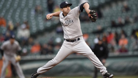 AP source: Chapman, Yankees reach deal for $86M, 5 years
