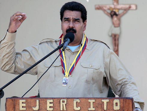 Venezuelan President Nicolas Maduro delivers a speech during a meeting with members of the national army in Falcon state, Venezuela on September 30, 2013. Maduro ordered the expulsion of the top US diplomat in Venezuela and two other embassy official