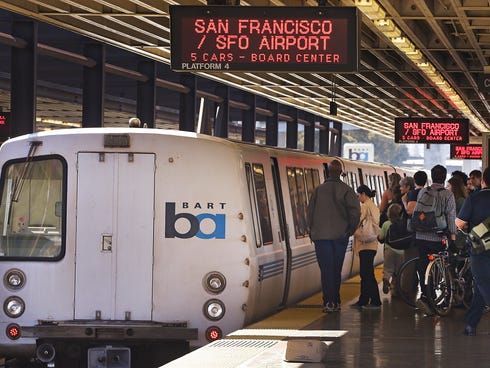 Passengers board a Bay Area Rapid Transit train Oct. 15, 2013, in Oakland, Calif.