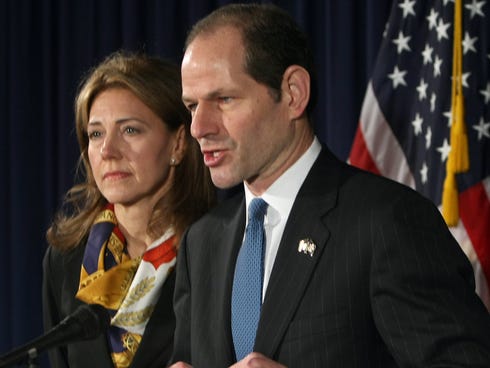 Eliot Spitzer, with wife Silda Wall, on March 12, 2008, announcing he would resign as New York governor amid a sex scandal.