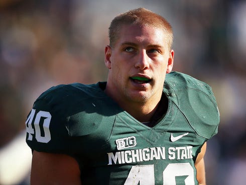 Michigan State linebacker Max Bullough (40) walks off the field after a game against the Northwestern Wildcats at Spartan Stadium.