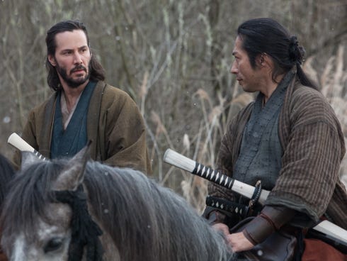 Keanu Reeves as Kai, left, and Hiroyuki Sanada as Oishi appear in the action-adventure 