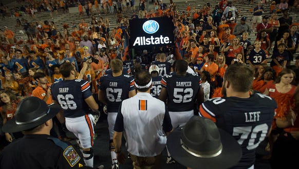 Auburn head coach Gus Malzahn walks out with Auburn