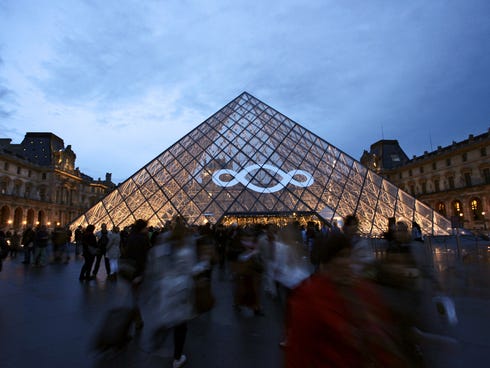 People leave the Louvre Museum after the 2013 European Night of the Museums on May 18, 2013