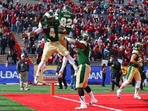 Dec 21, 2013; Albuquerque, NM, USA; Colorado State Rams wide receiver Charles Lovett (4) celebrates with teammates after catching a touchdown in the first quarter against the Washington State Cougars during the Gildan New Mexico Bowl at University St