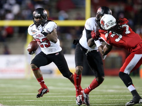 Jan 5, 2014; Mobile, AL, USA; Arkansas State Red Wolves wide receiver J.D. McKissic (23) carries the ball against the Ball State Cardinals in the first half at Ladd-Peebles Stadium. Mandatory Credit: Crystal LoGiudice-USA TODAY Sports