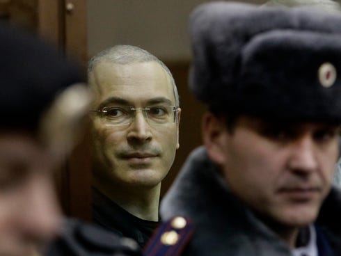 Mikhail Khodorkovsky seen on Dec. 30, 2010, from behind glass at a court room in Moscow.