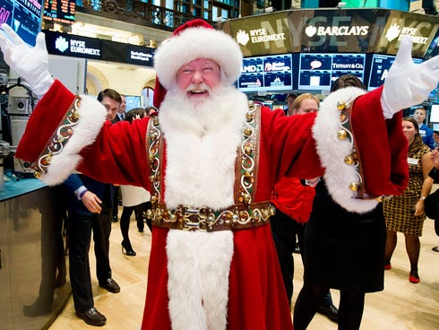 A man portraying Santa Claus visits the trading floor of the New York Stock Exchange, Wednesday Nov. 21, 2012 before he participated in opening bell ceremonies featuring the Macy's Thanksgiving Day Parade.