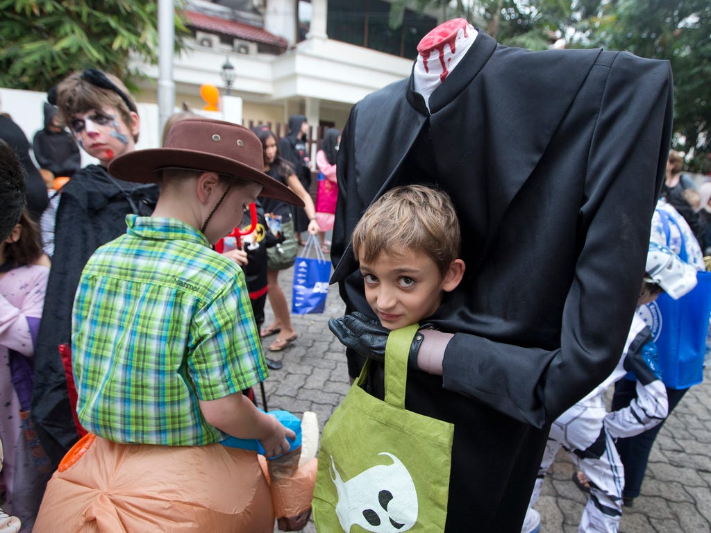 Children dressed for Halloween prepare to trick-or-treat in a housing compound in Jakarta, Indonesia on Oct. 31.