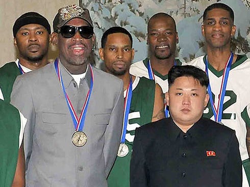 This photo taken on Jan. 8, 2014, and released by North Korea's official Korean Central News Agency (KCNA), shows North Korean leader Kim Jong-Un (front R) photographed with former U.S. basketball star Dennis Rodman.