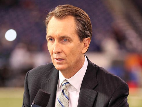 Football personality Cris Collinsworth talks on television before Super Bowl XLVI between the New York Giants and the New England Patriots at Lucas Oil Stadium.