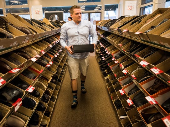 Danny McKenzie, of Hanover, browses men's shoes for