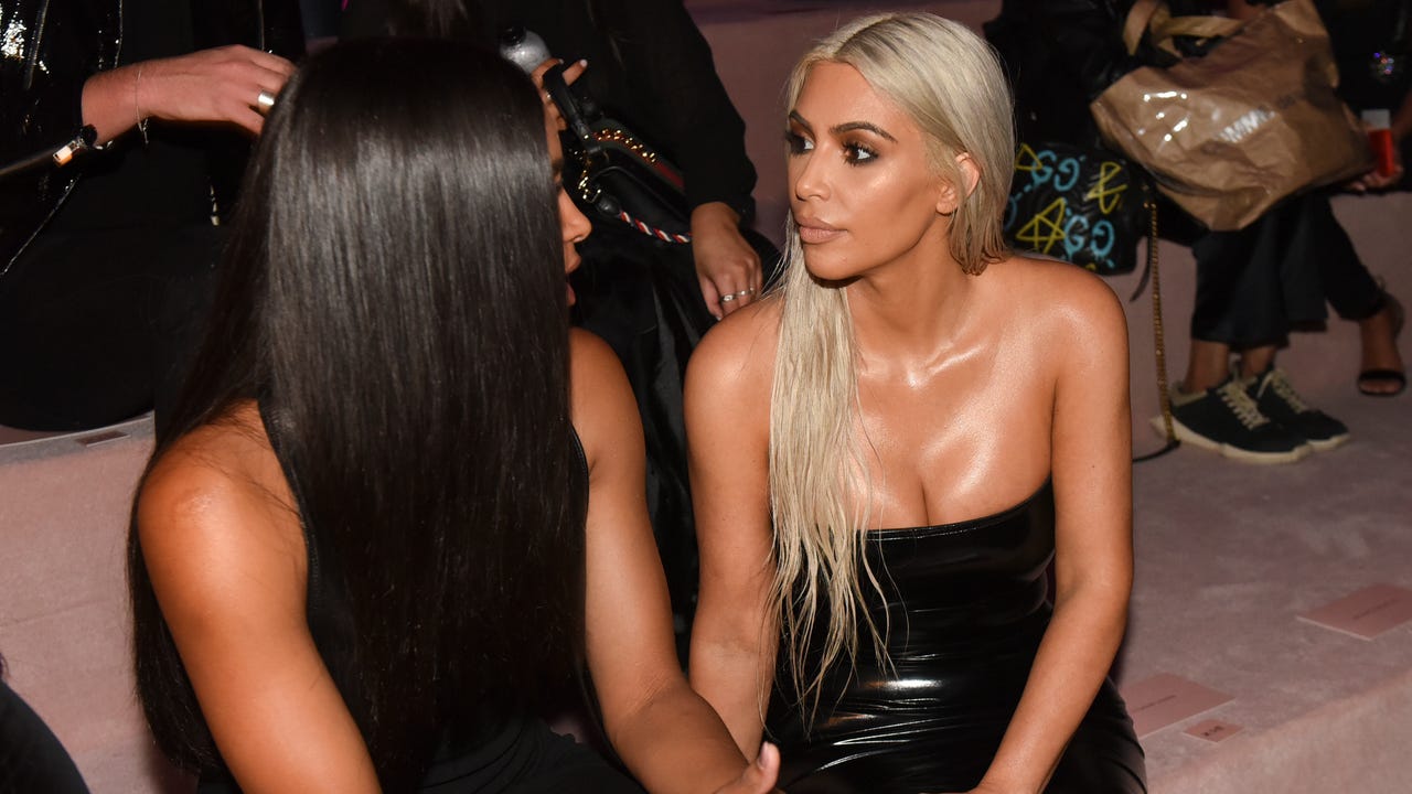 Silver-haired Kim Kardashian leads parade of celebs at Tom Ford show