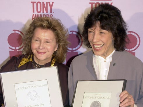 Lily Tomlin, right, and Jane Wagner hold up the Tony Award nominations they earned as producers of 