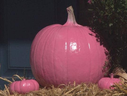 Hear why this yard is covered in pink pumpkins