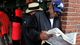 Race fan Dirk Jemmott reads The Racing Form next to the betting windows before the 2013 Kentucky Derby