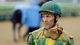 Hall of Fame jockey Gary Stevens looks on after a race