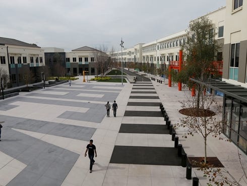 Facebook employees are shown on the campus in Menlo Park, Calif