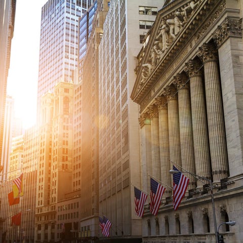 View down Wall Street at sunrise.