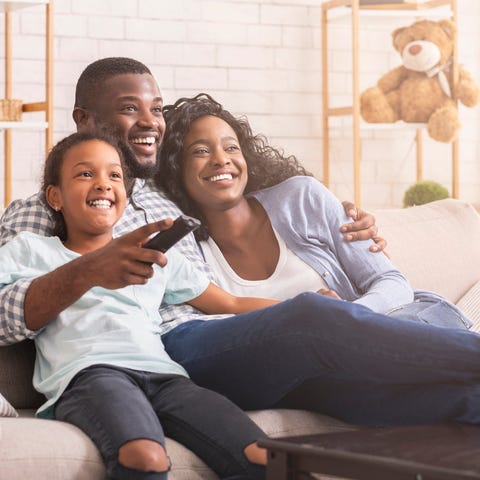 Family watching TV.