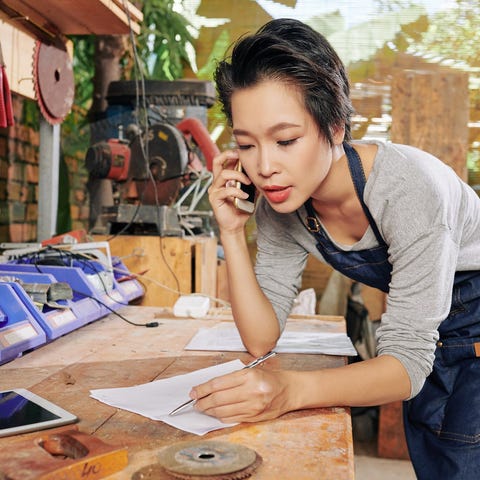 Woman on the phone in her small business.