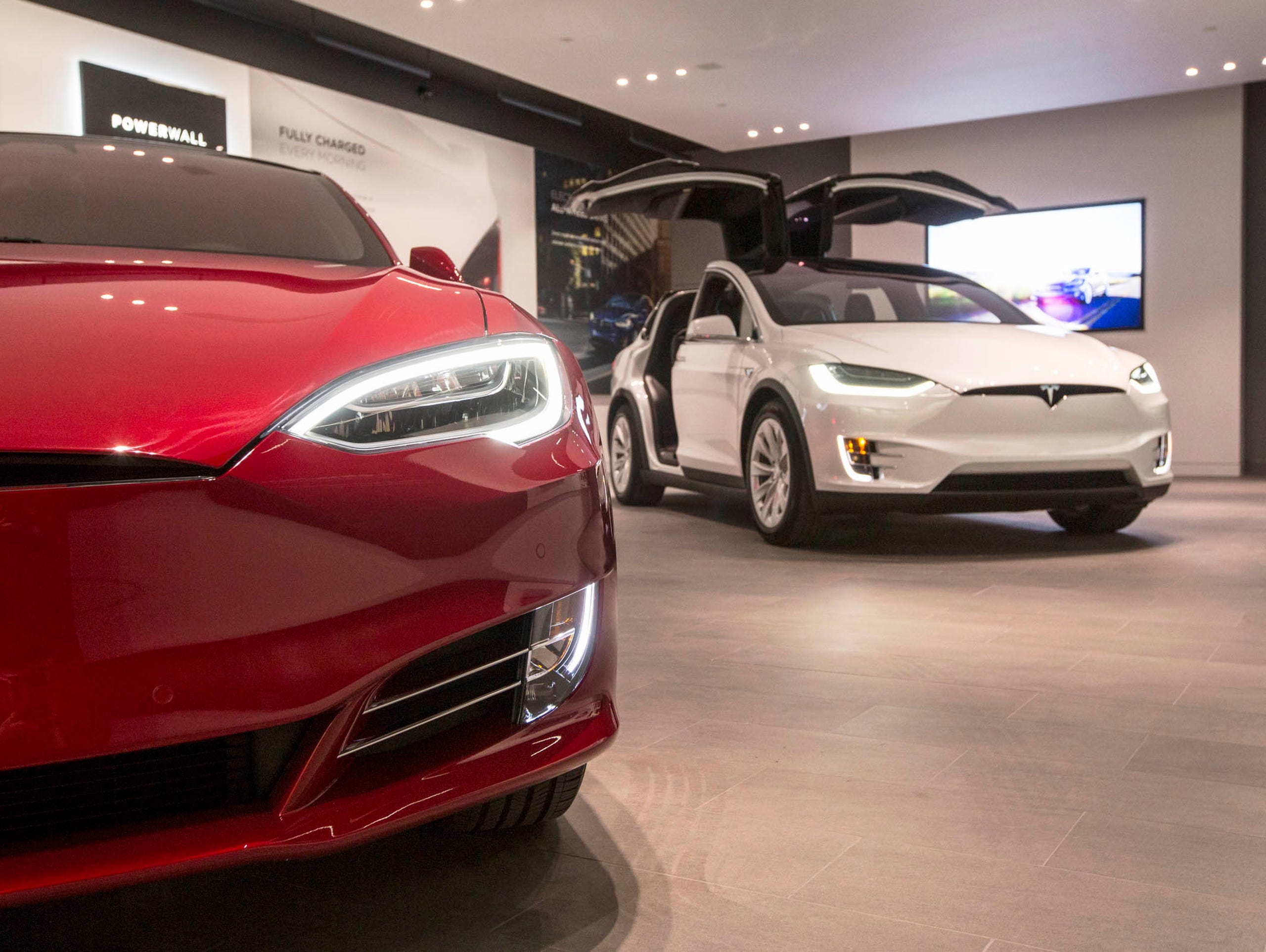 The Tesla Model S, left, and the Model X are seen in the showroom at Somerset Collection North in Troy on Thursday, October 26, 2017.