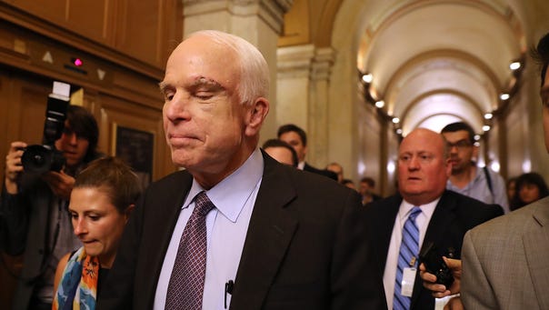 Sen. John McCain, R-Ariz., leaves the the Senate chamber