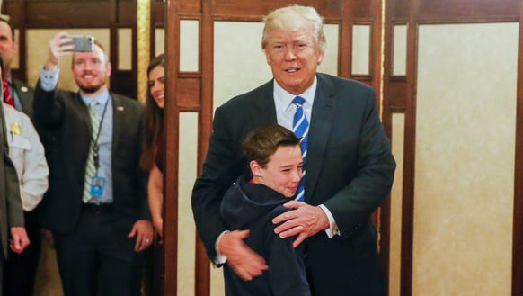 President Trump greets Jack Cornish, 10, of Birmingham,