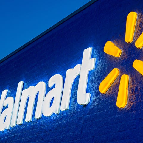 The exterior of a Walmart building features the co