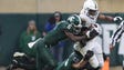 Michigan State's Davis Dowell and Kenny Willekes tackle