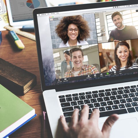 A person having a group meeting through Zoom on th