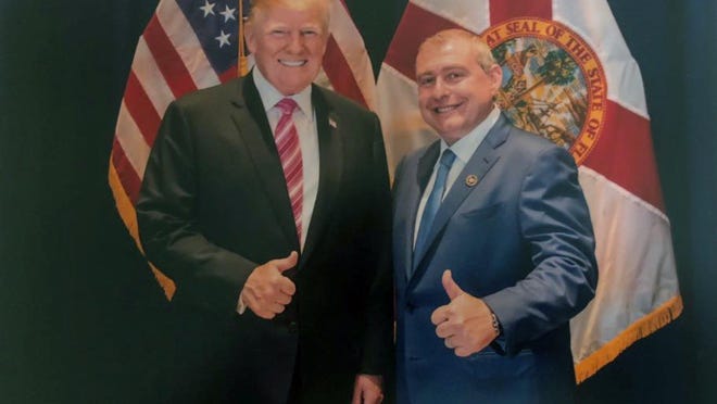 This undated image released by the House Judiciary Committee from documents provided by Lev Parnas to the committee in the impeachment probe against President Donald Trump, shows a photo of Lev Parnas with Trump in Florida. Parnas, a close associate of Trump's personal lawyer Rudy Giuliani is claiming Trump was directly involved in the effort to pressure Ukraine to investigate Democratic rival Joe Biden. Trump on Thursday, Jan. 16, 2020, repeated denials that he is acquainted with Parnas, despite numerous photos that have emerged of the two men together.