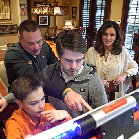 Butch Jones watches over his sons Andrew, left, an