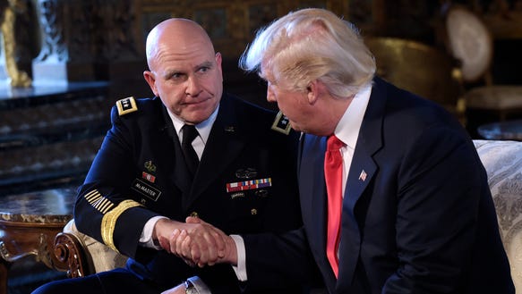 President Trump, right, shakes hands with Army Lt.