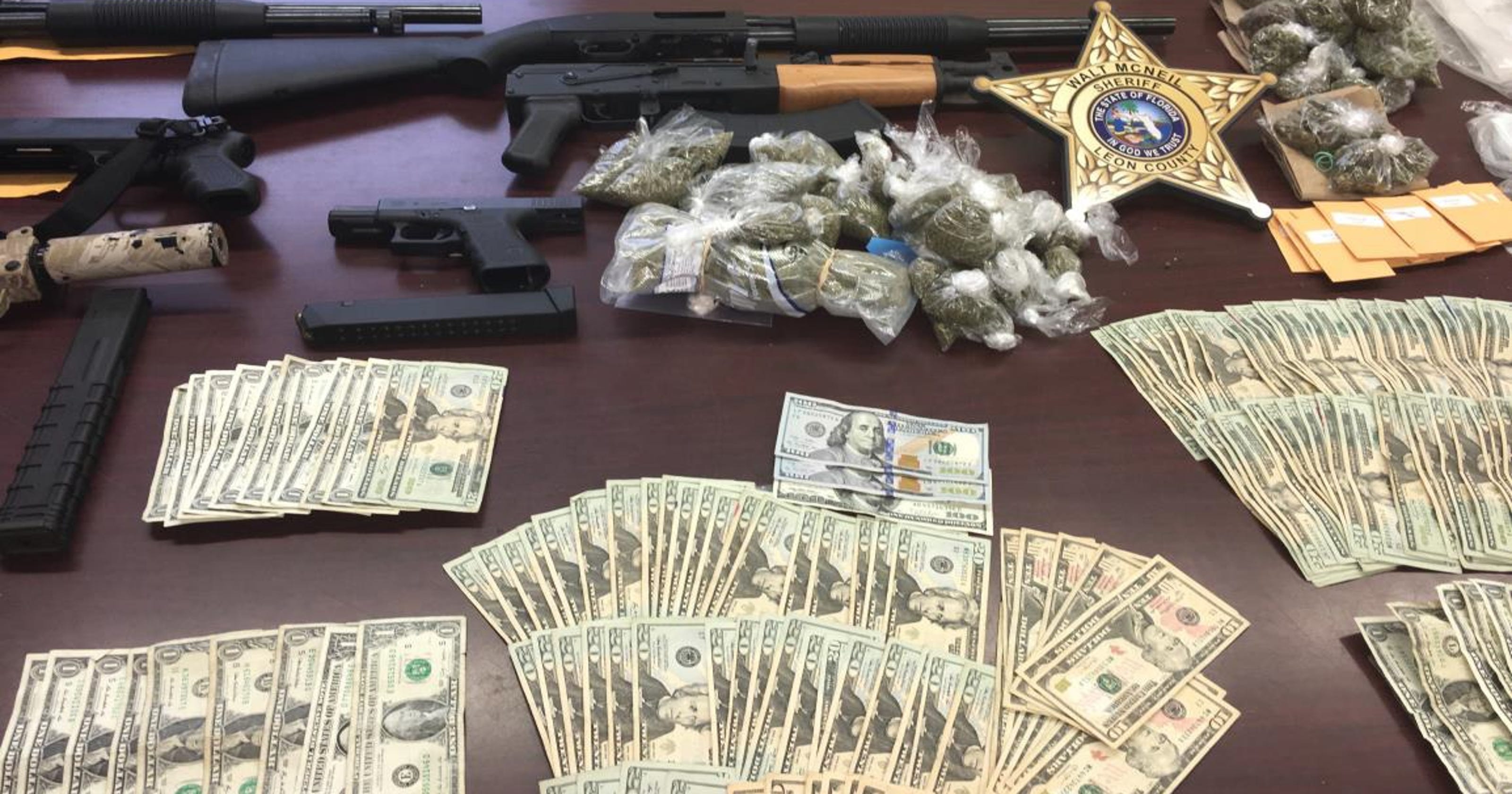 Guns Drugs And Cash Seized In Apartment Raid
