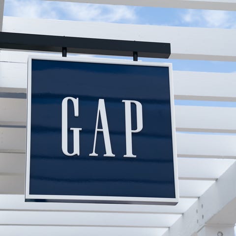 A Gap sign outside of a store.